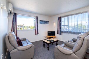 Twin Unit - Sleeps 3 | Living area | 32-inch flat-screen TV with satellite channels, TV