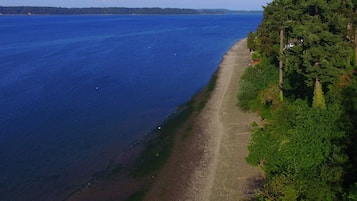 On the beach, sun-loungers
