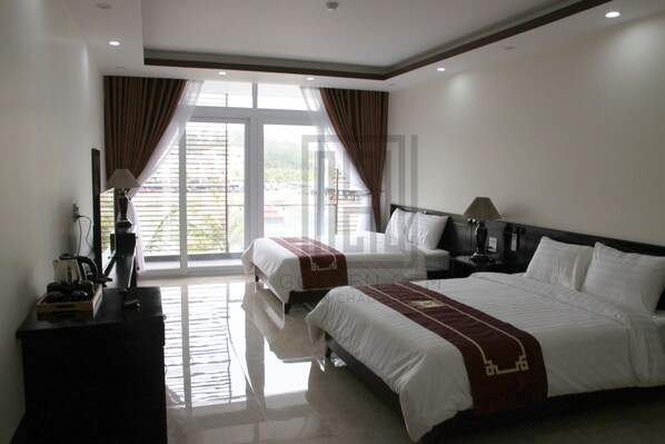 Deluxe Room, 2 Queen Beds | In-room safe, desk, blackout drapes, soundproofing