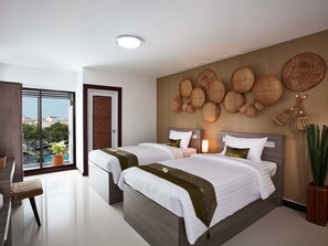 A modern hotel room with two beds, a large window with a city view, and a wall decorated with woven baskets. - Baan Thai Boutique (Bangkok)