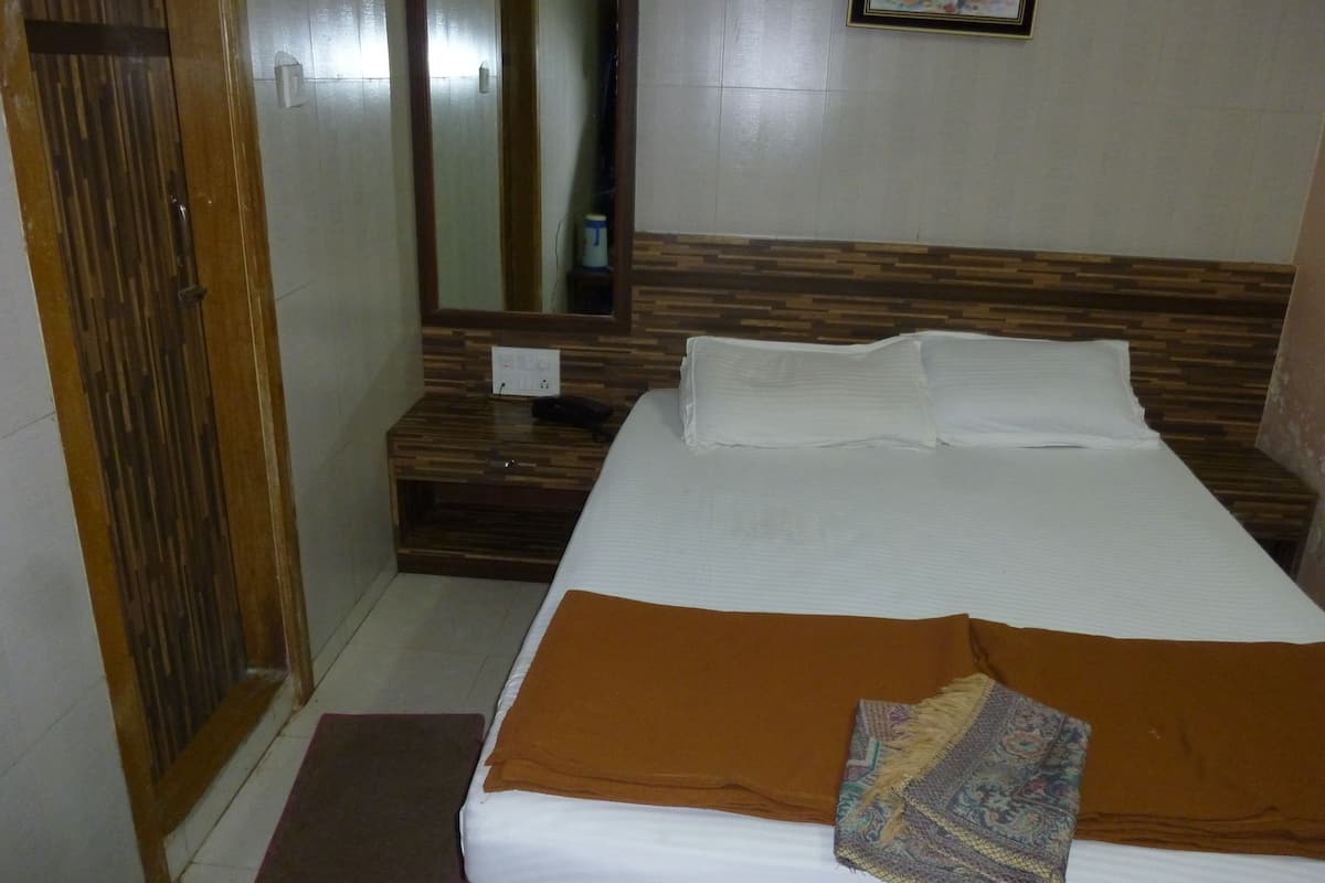 Habitación Deluxe | Ropa de cama de alta calidad y camas con efecto memoria