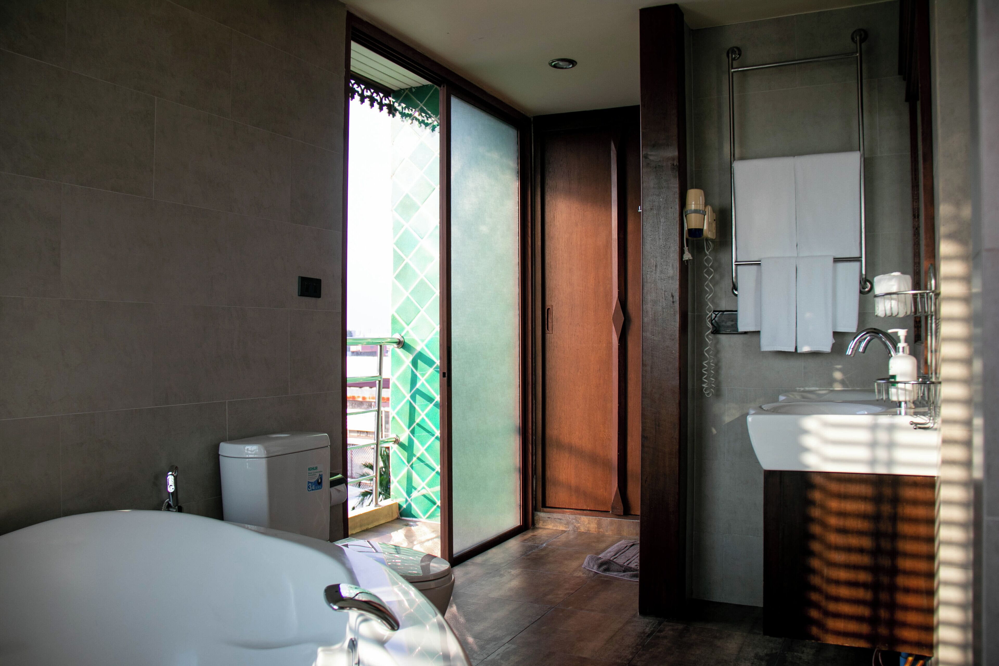 lamphu tree suite (main building) | bathroom | shower, free toiletries, hair dryer, towels