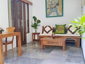Studio Suite, Terrace | Living room | LCD TV - Omah Lembu Villa (Abiansemal)