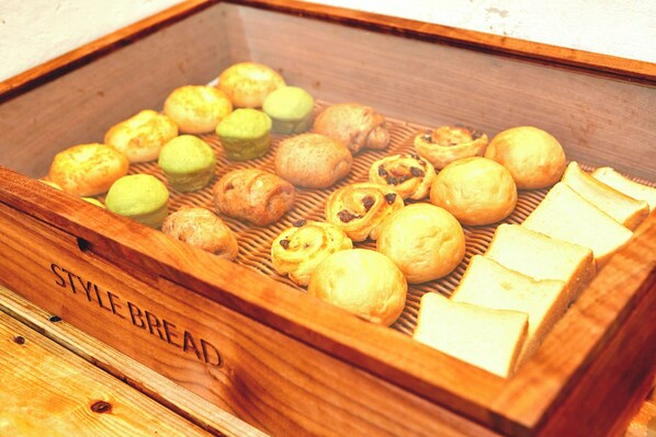 A wooden box labeled "STYLE BREAD" containing various pastries and bread slices. - Centurion Hotel Classic Nara (Nara)