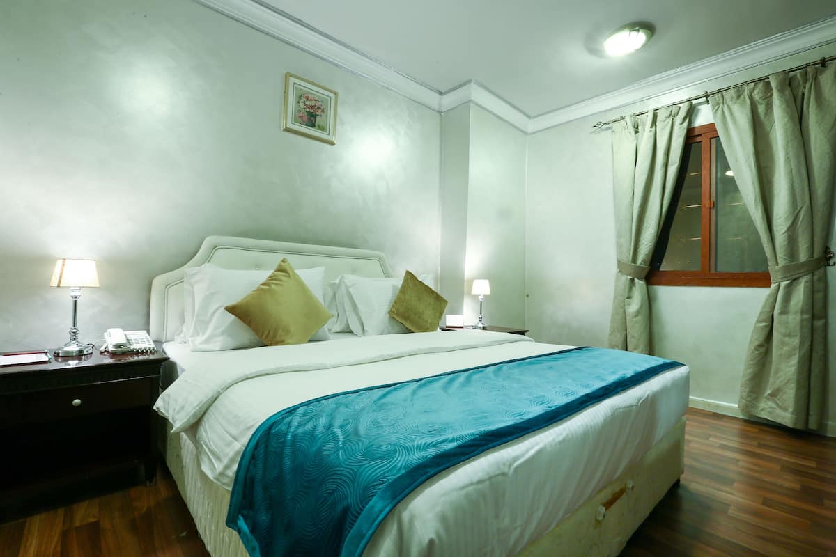 Grand Suite, 1 Bedroom | In-room safe, desk, blackout drapes, iron/ironing board