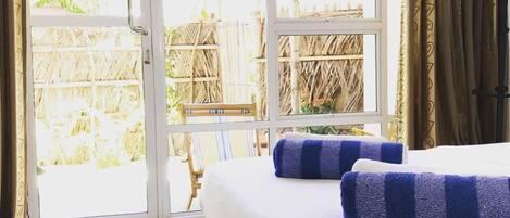 Superior Room, 1 Queen Bed, Patio, Garden View | 1 bedroom, minibar, in-room safe, iron/ironing board