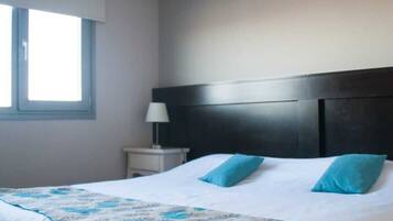 Ropa de cama de alta calidad y minibar