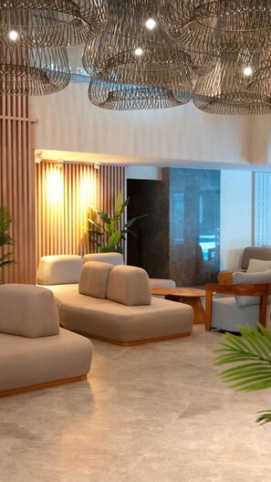 A modern living room with a sectional sofa, a wooden coffee table, and a large window providing a view of the outdoors.