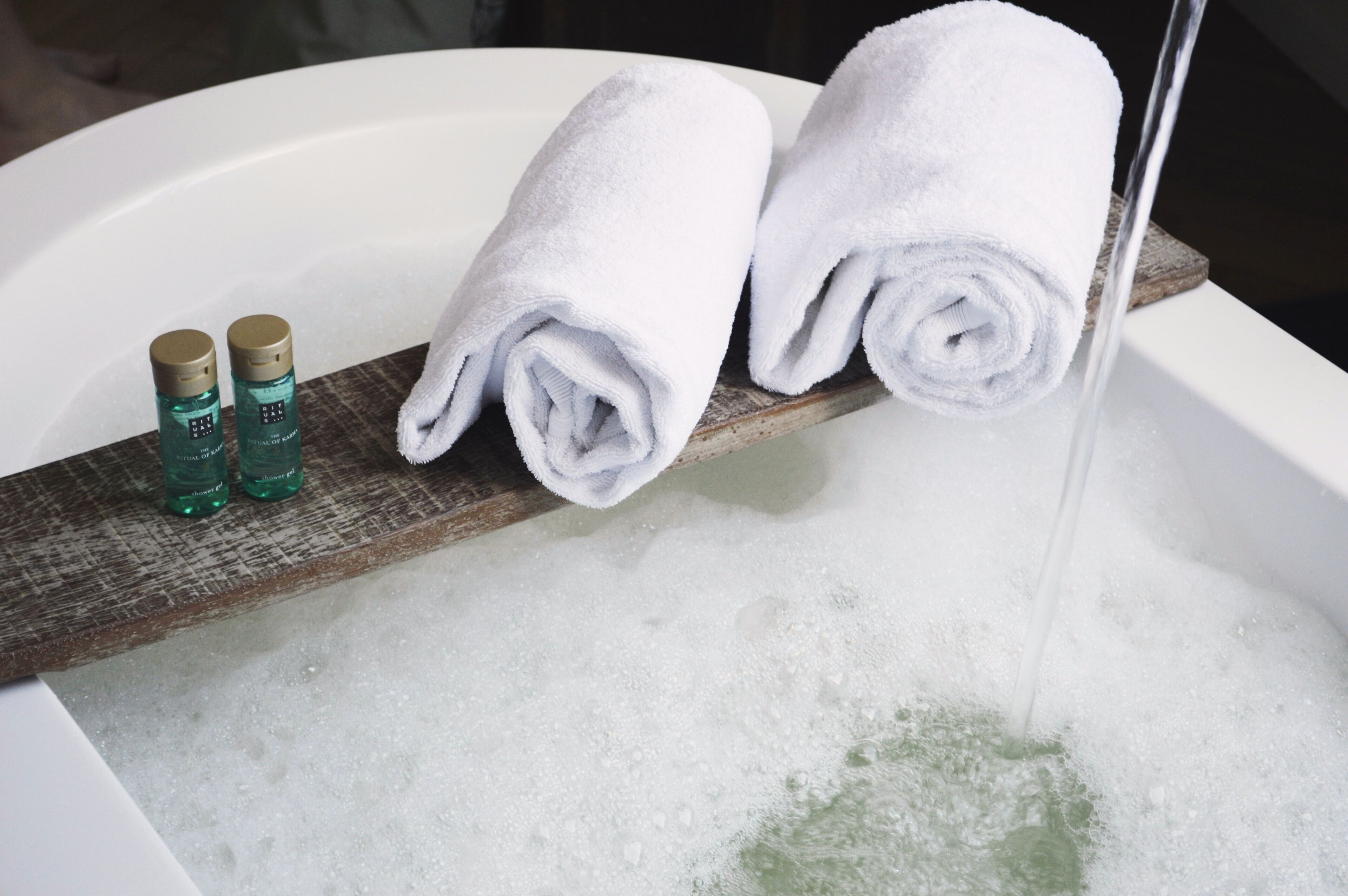 junior suite | bathroom | rainfall showerhead, designer toiletries, hair dryer, towels