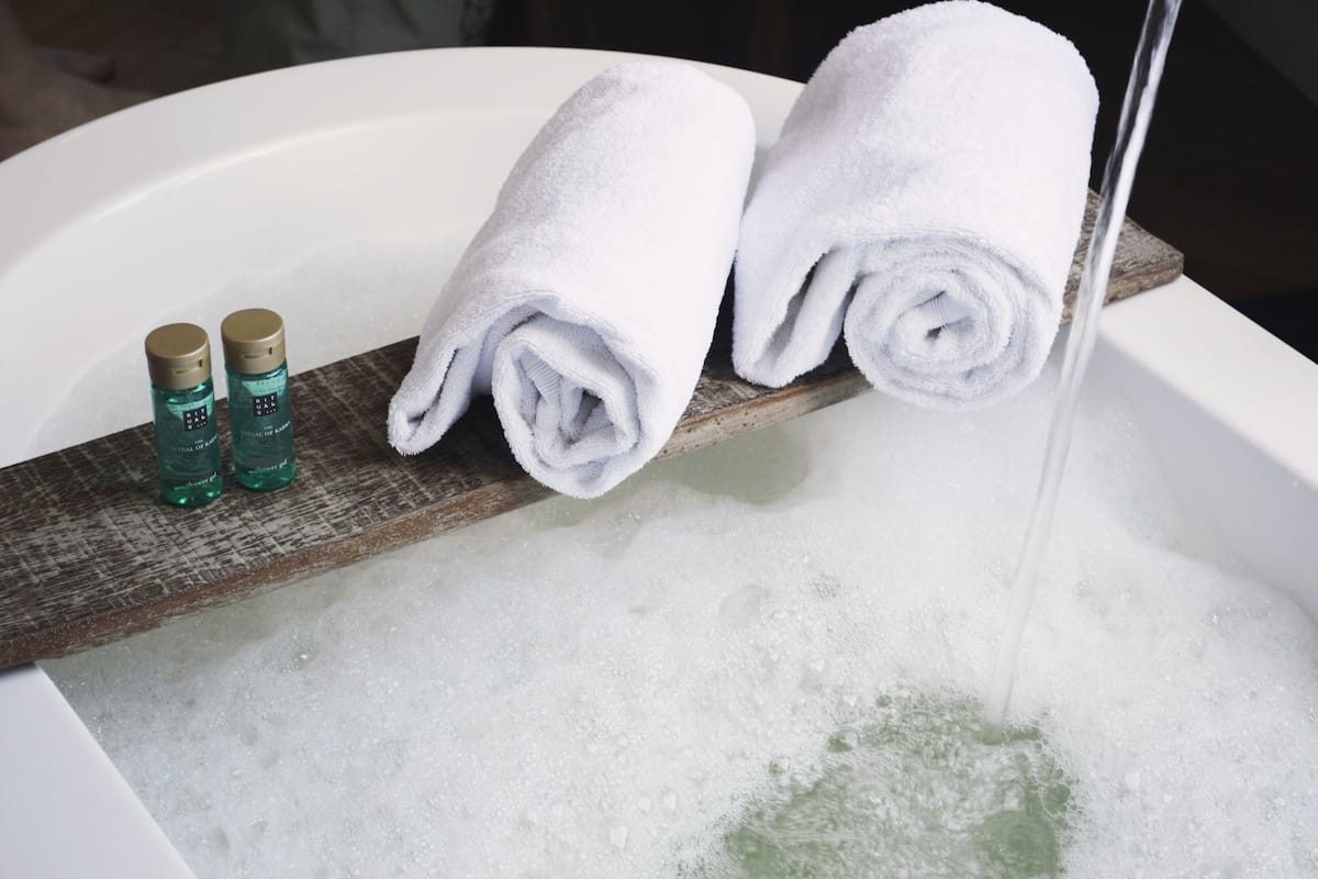 junior suite | bathroom | rainfall showerhead, designer toiletries, hair dryer, towels