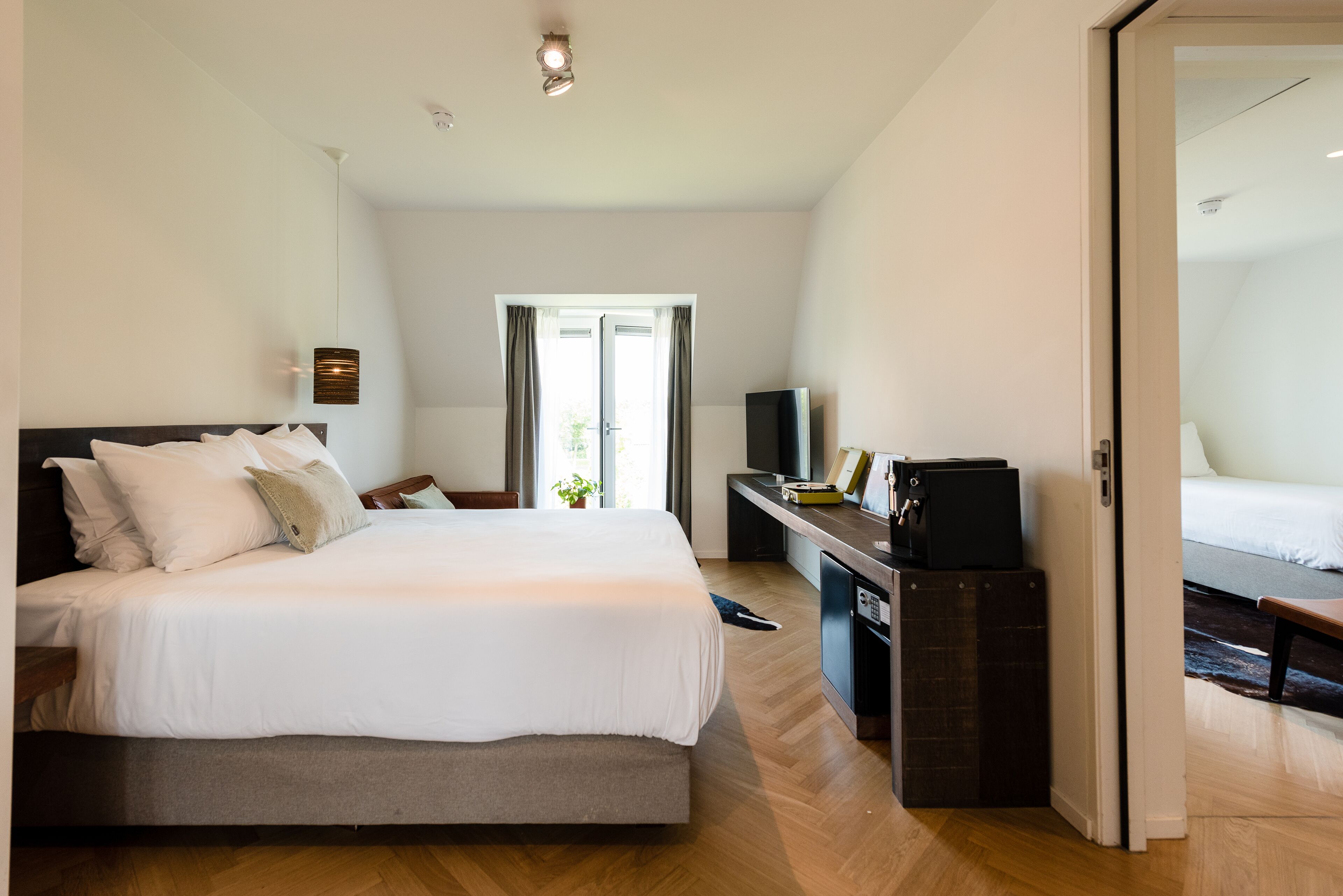 family room, 2 bedrooms | 1 bedroom, minibar, in-room safe, blackout curtains