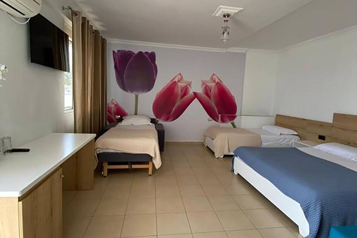 Quadruple Room (Shared Balcony) | Desk, WiFi (free), bed sheets