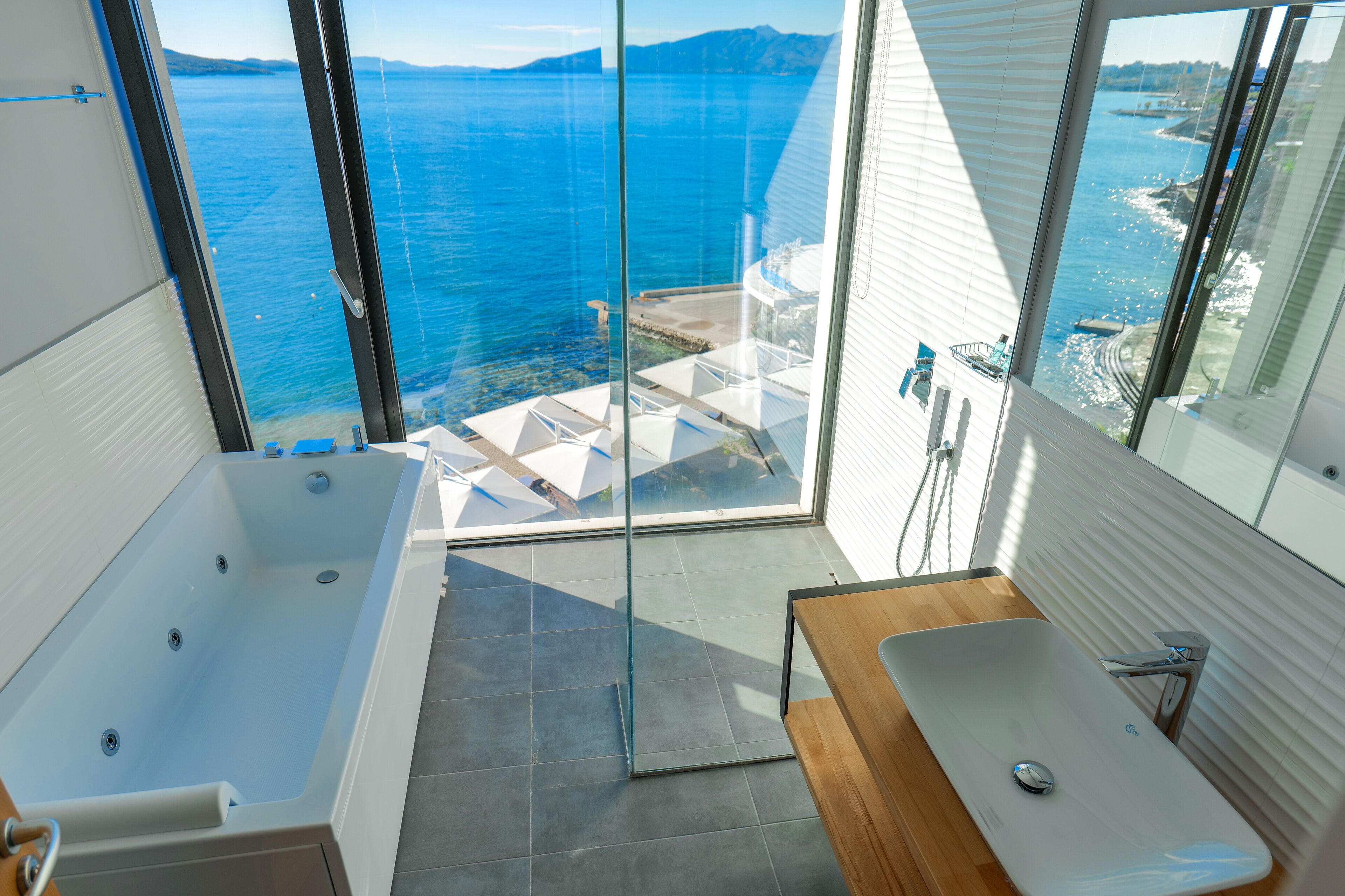suite, sea view | bathroom | shower, free toiletries, hair dryer, towels