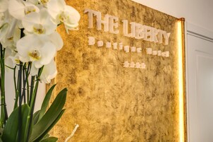 A sign with the text "THE LIBERTY Boutique Hotel".