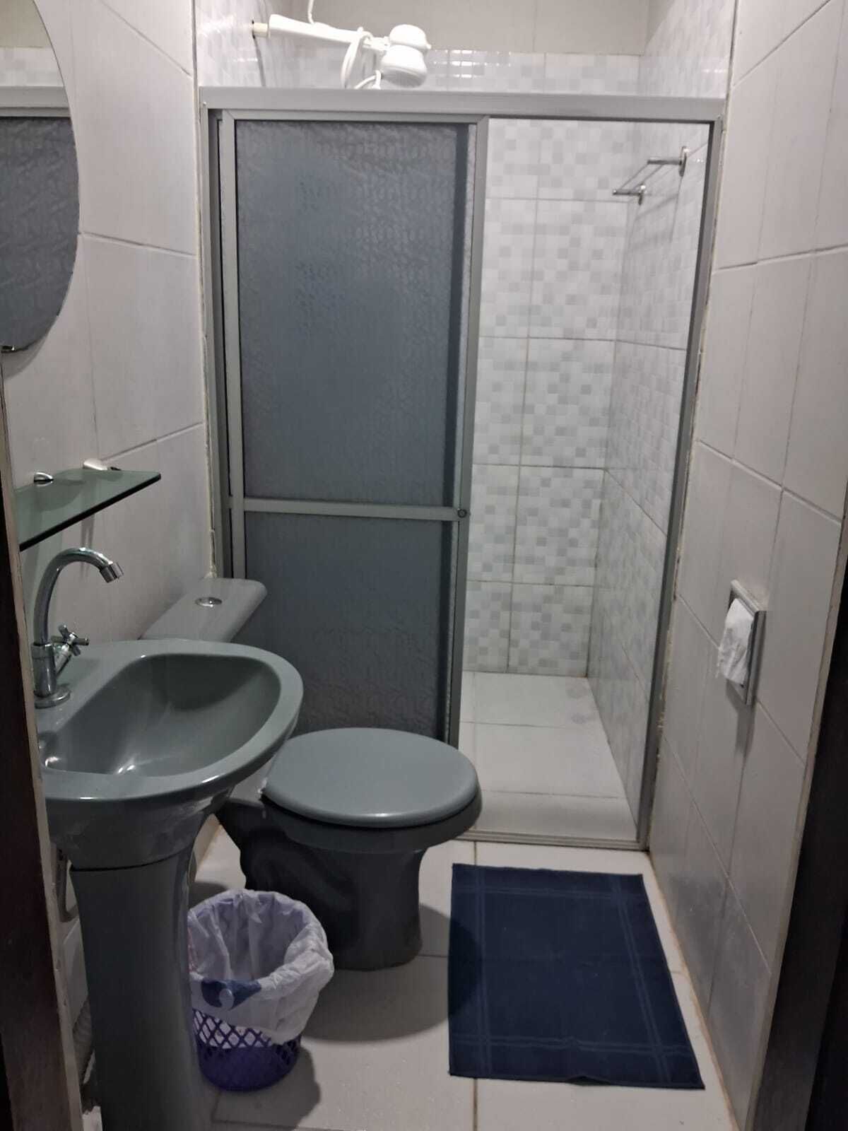 economy suite | bathroom | shower, towels, soap, toilet paper