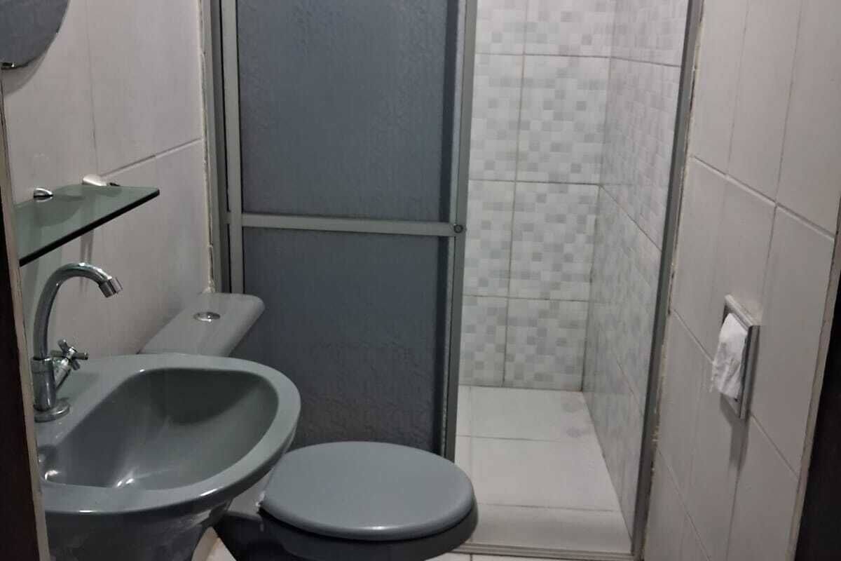 economy suite | bathroom | shower, towels, soap, toilet paper