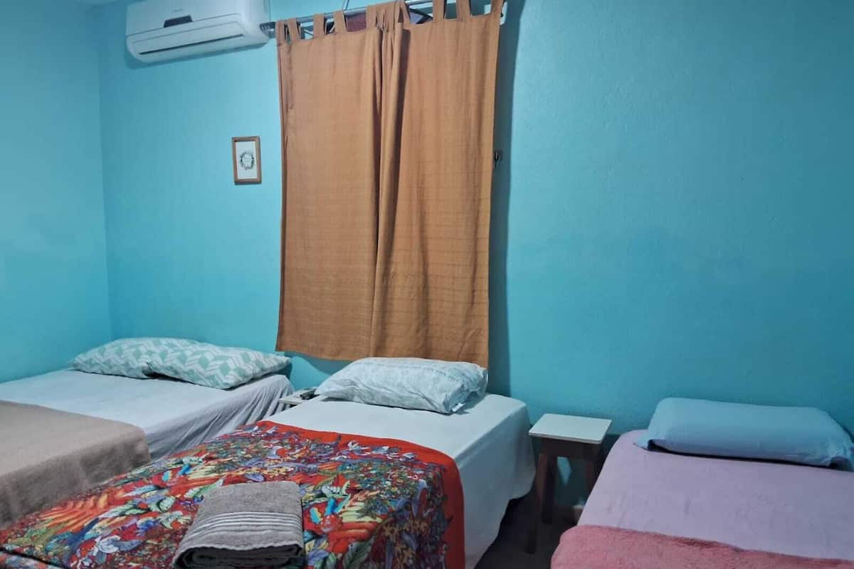 economy suite | minibar, desk, blackout curtains, iron/ironing board