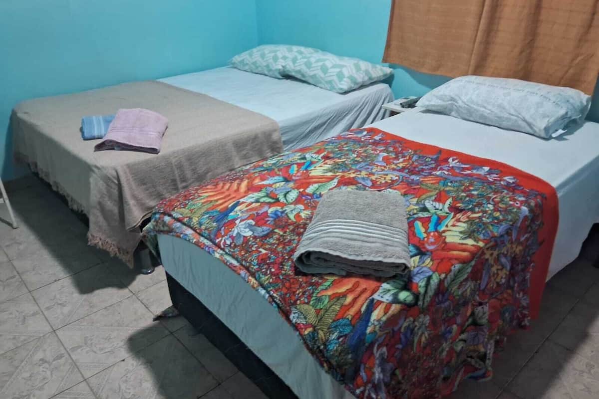 economy suite | minibar, desk, blackout curtains, iron/ironing board