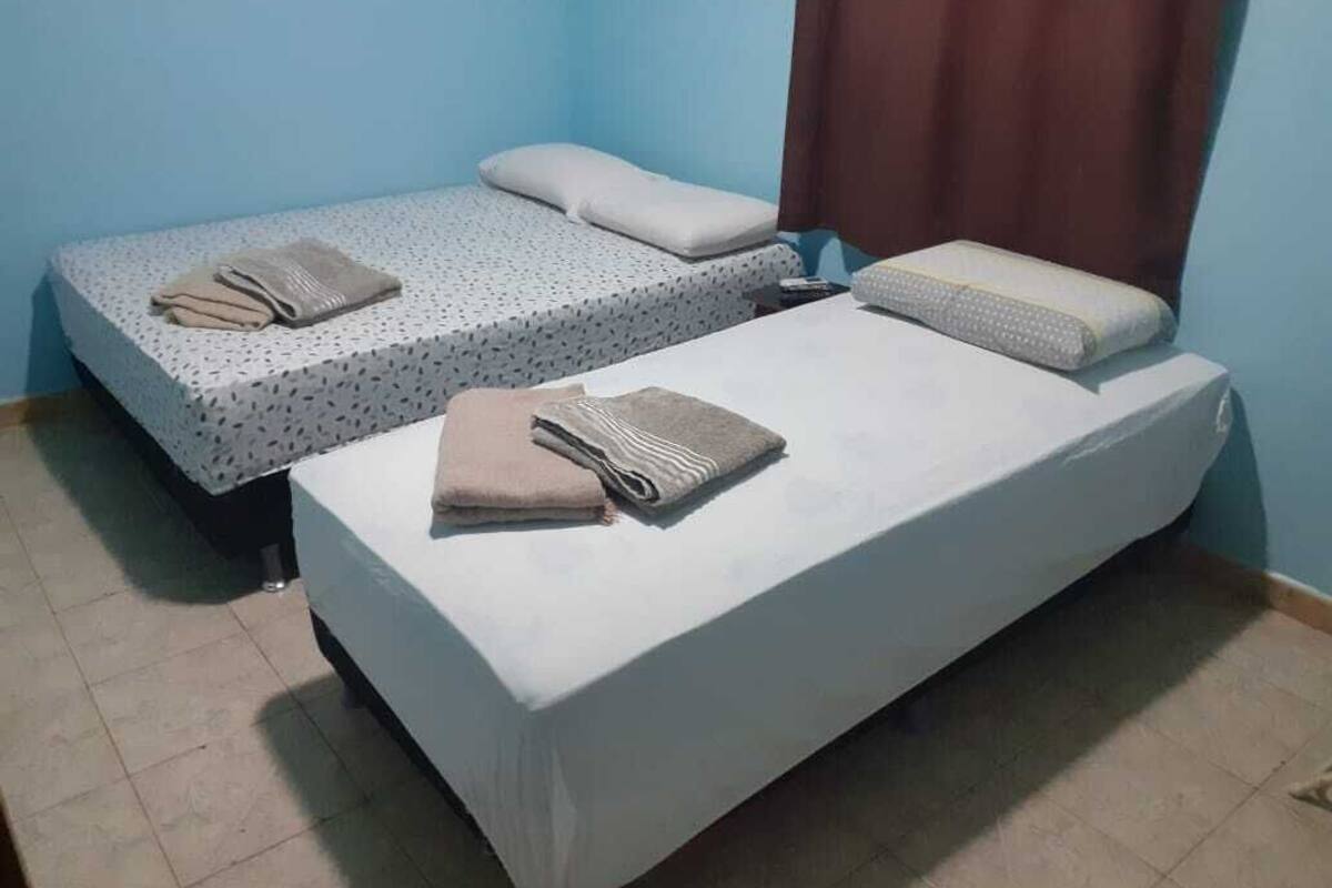 economy suite | minibar, desk, blackout curtains, iron/ironing board