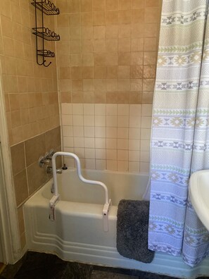 Combined shower/tub, hair dryer, towels, soap