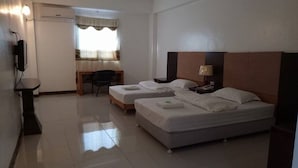 A hotel room with two single beds, a desk, a chair, a lamp, and a TV. - Asia Novo Boutique Hotel - Sorsogon (Sorsogon City)
