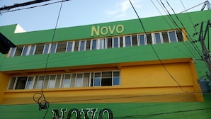 A building with a green and yellow facade, the name 'Novo' visible on the upper part. - Asia Novo Boutique Hotel - Sorsogon (Sorsogon City)