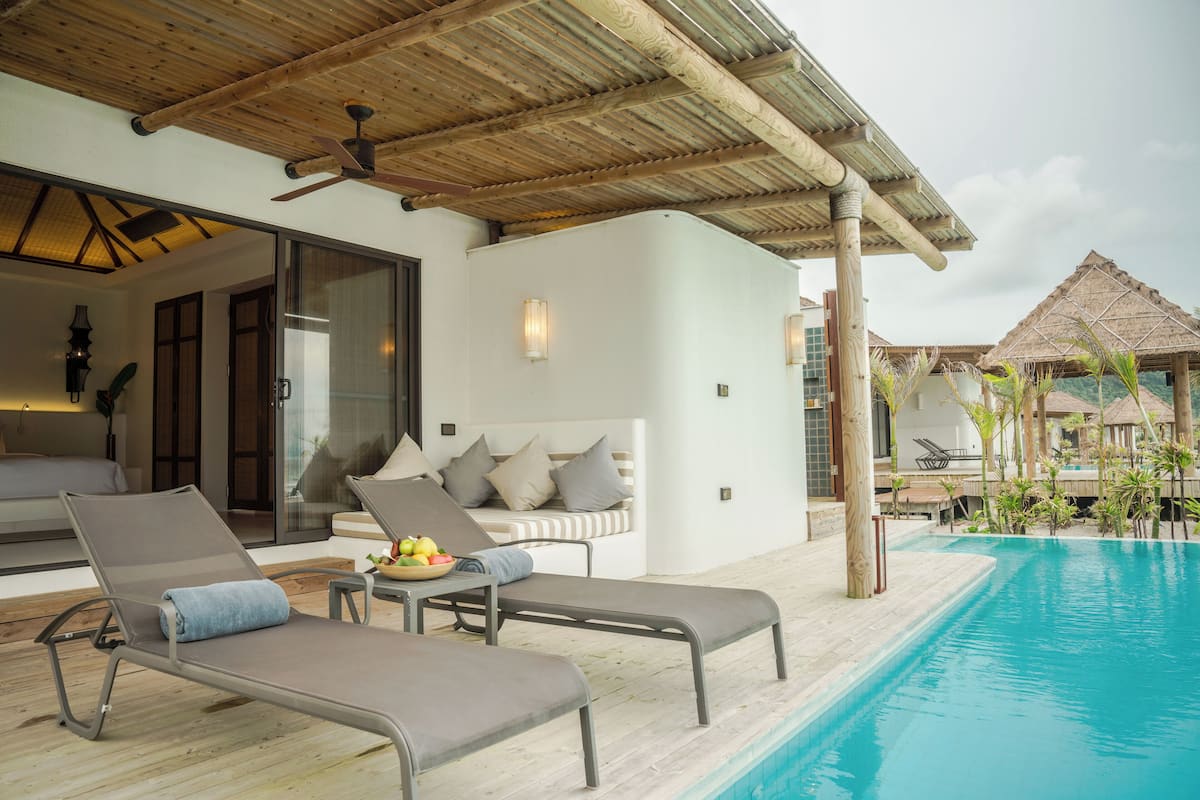 Deluxe Pool Villa | Minibar, in-room safe, individually decorated, individually furnished