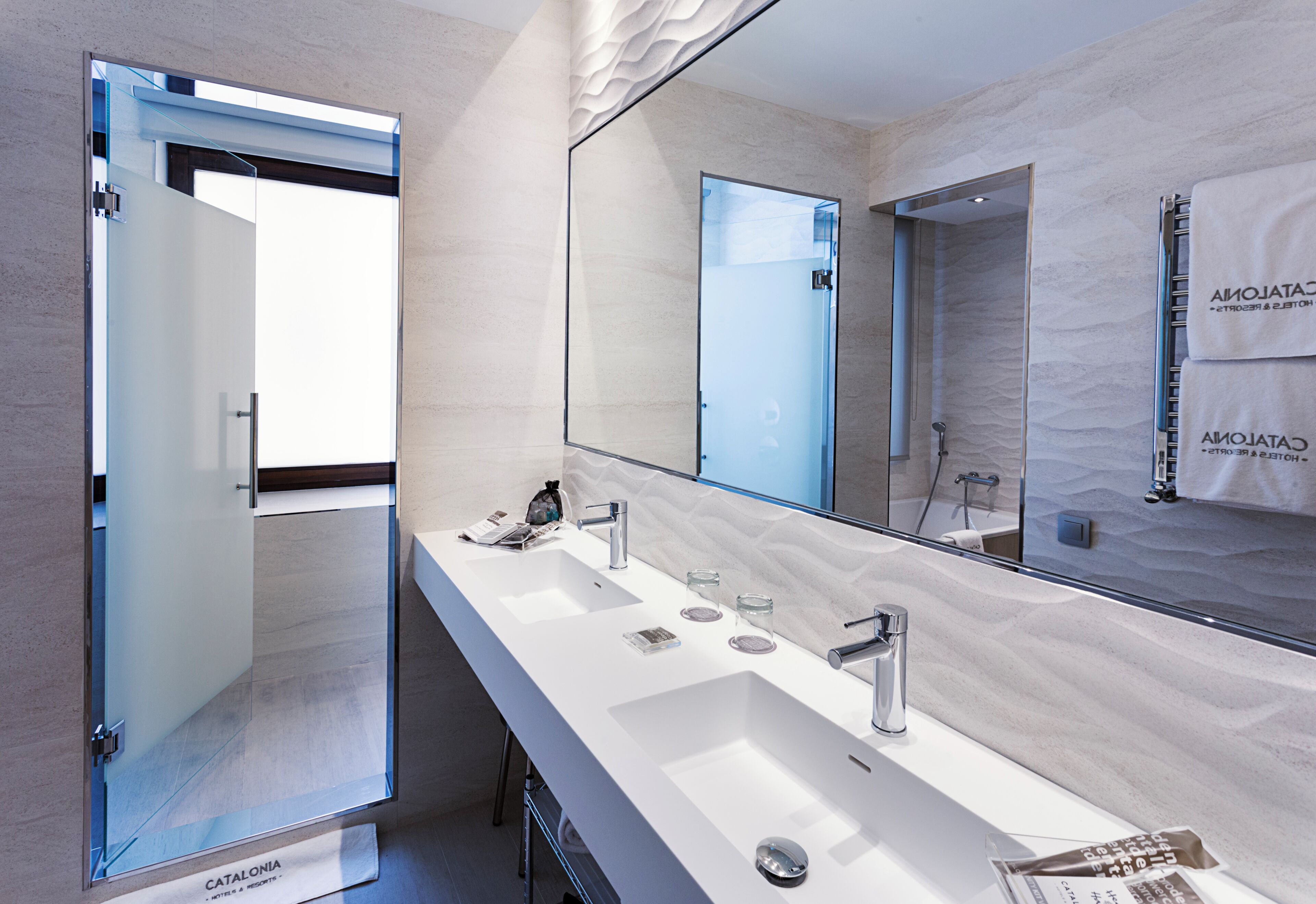 eco-friendly toiletries, hair dryer, towels