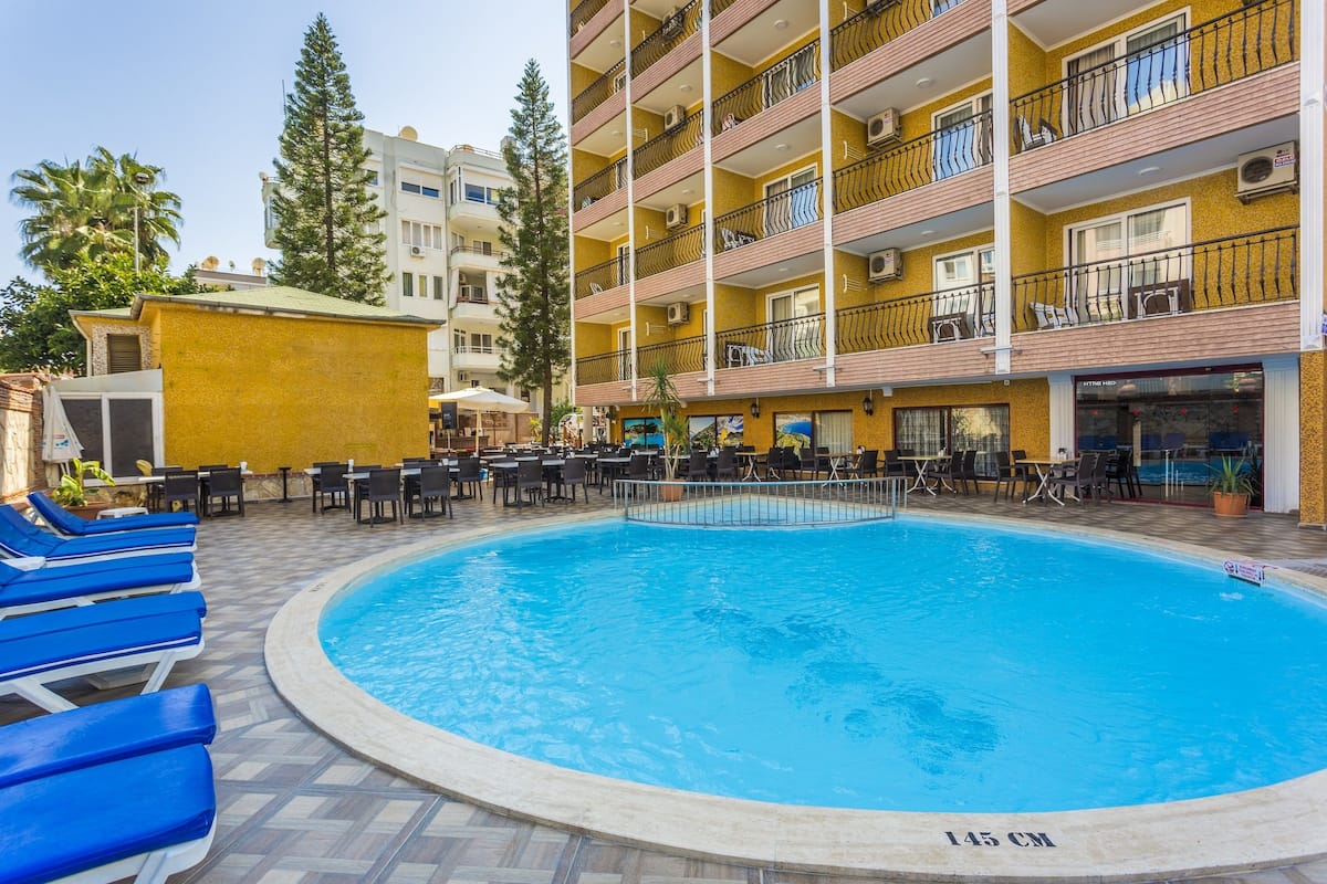 Outdoor pool, pool umbrellas, sun loungers