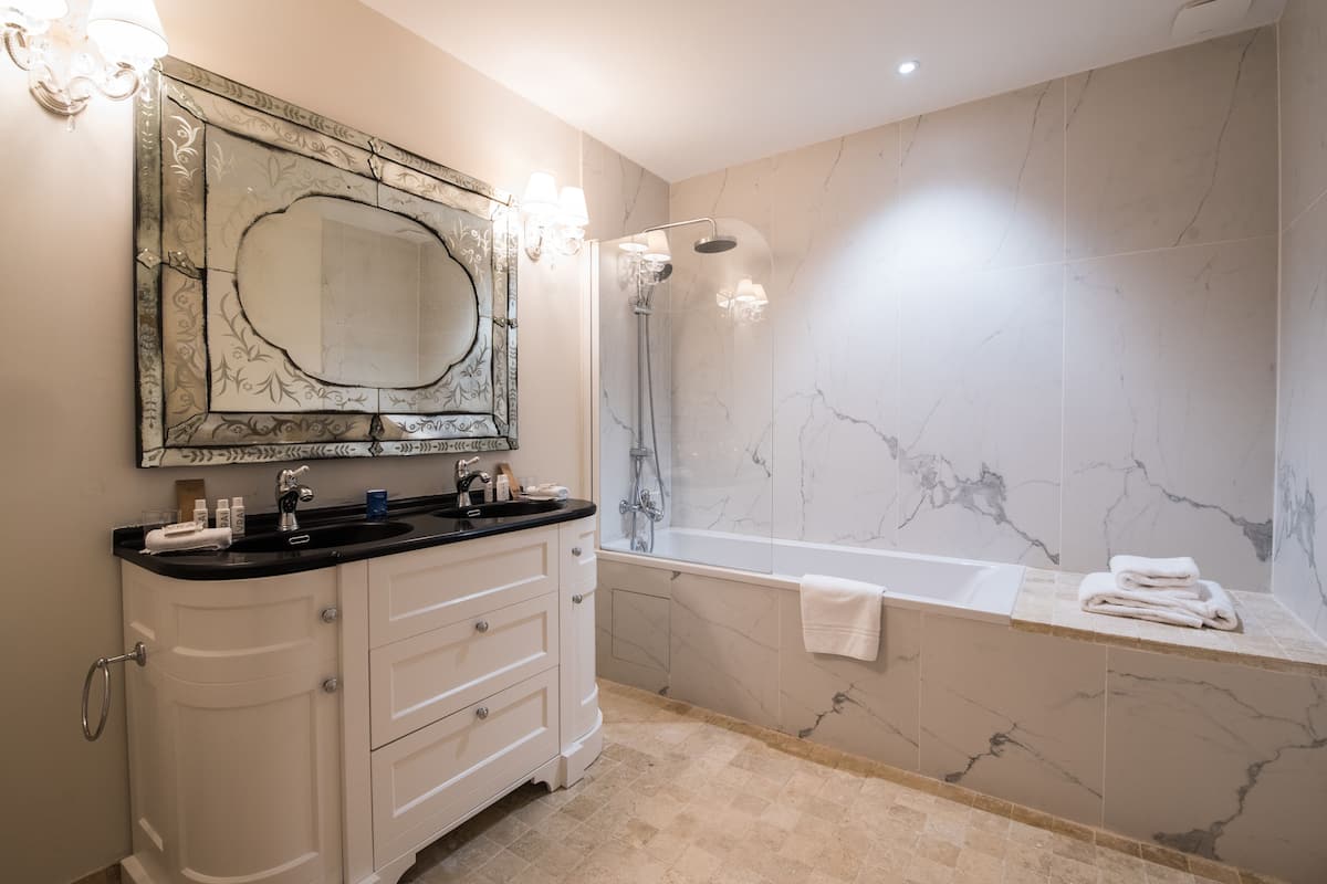 separate bathtub and shower, free toiletries, hair dryer, slippers