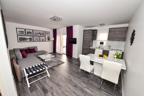 Deluxe Apartment, 1 Bedroom, Balcony, Sea View | Living area | LCD TV - Sunset Apartments (Vir)