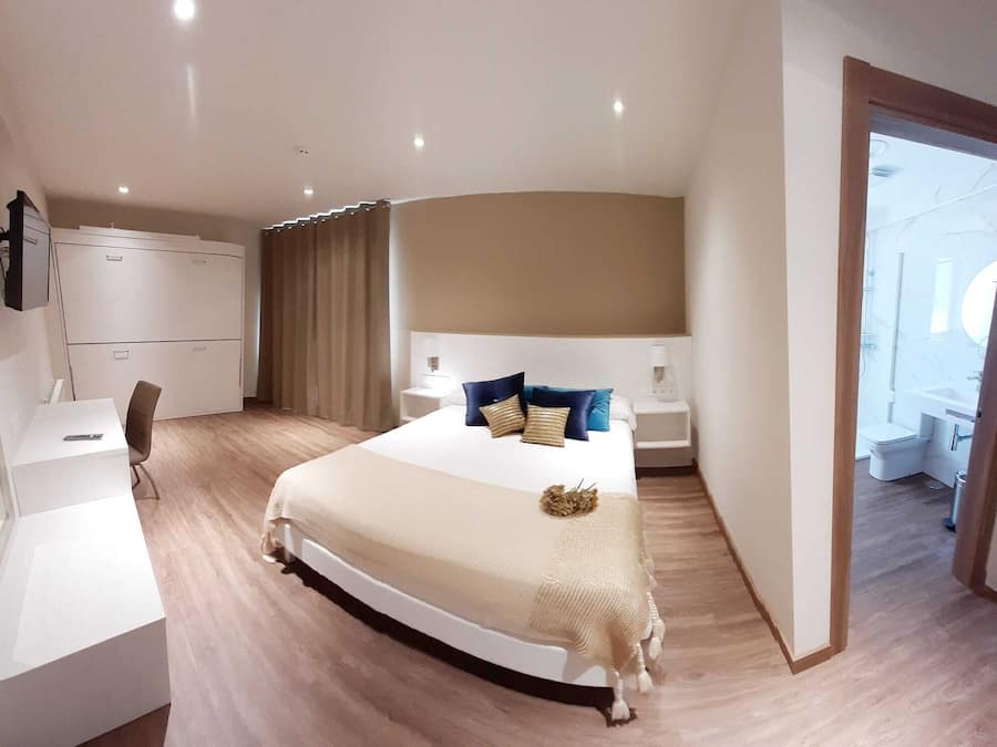 Quadruple Room | Premium bedding, desk, blackout drapes, free cribs/infant beds