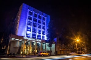 A hotel with a modern facade, large windows, and a visible entrance. - Hotel Centre Point (Nagpur)