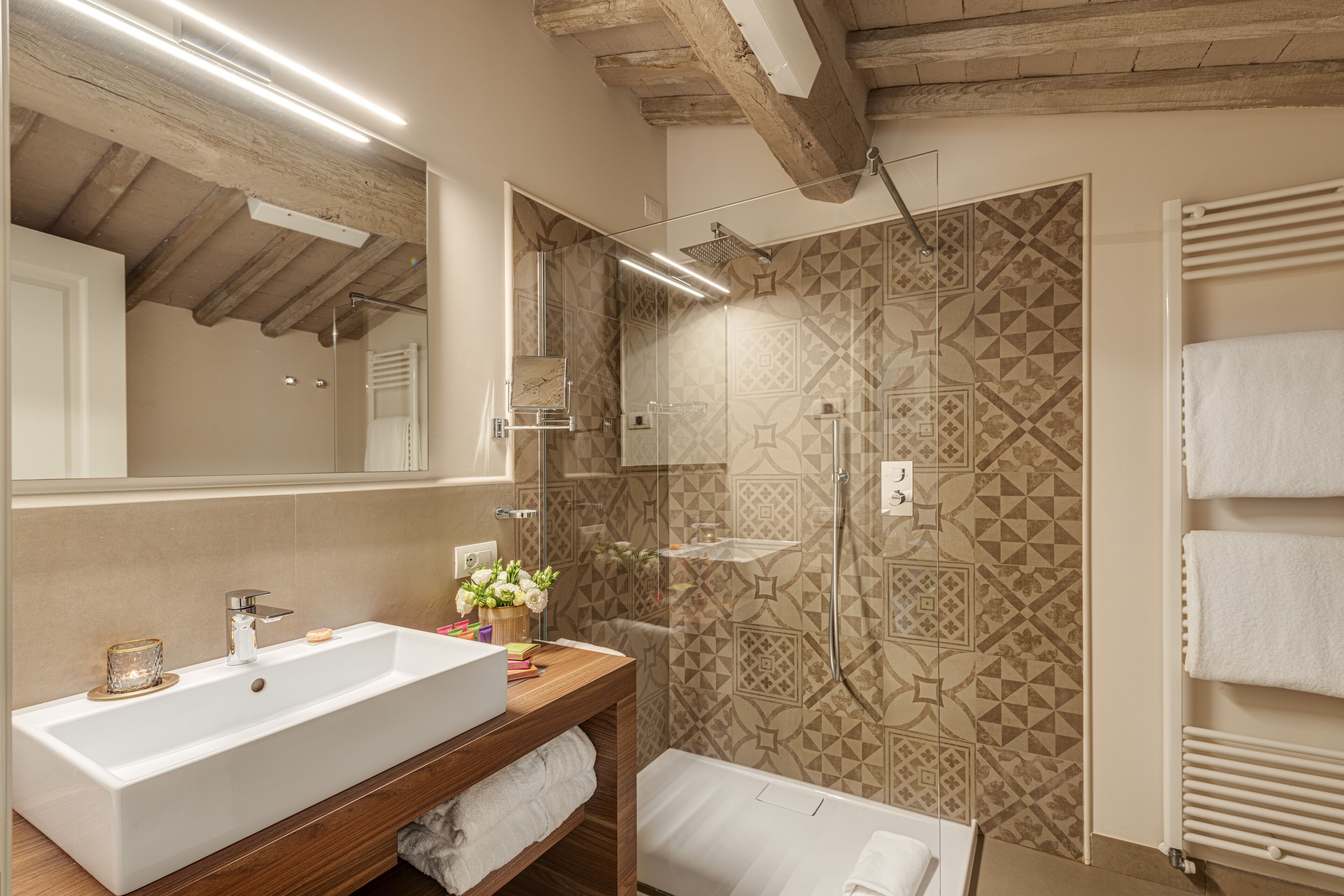 junior suite | bathroom | shower, free toiletries, hair dryer, bathrobes