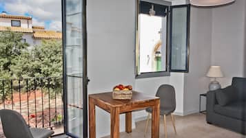 Suite, City View | Living area | Flat-screen TV