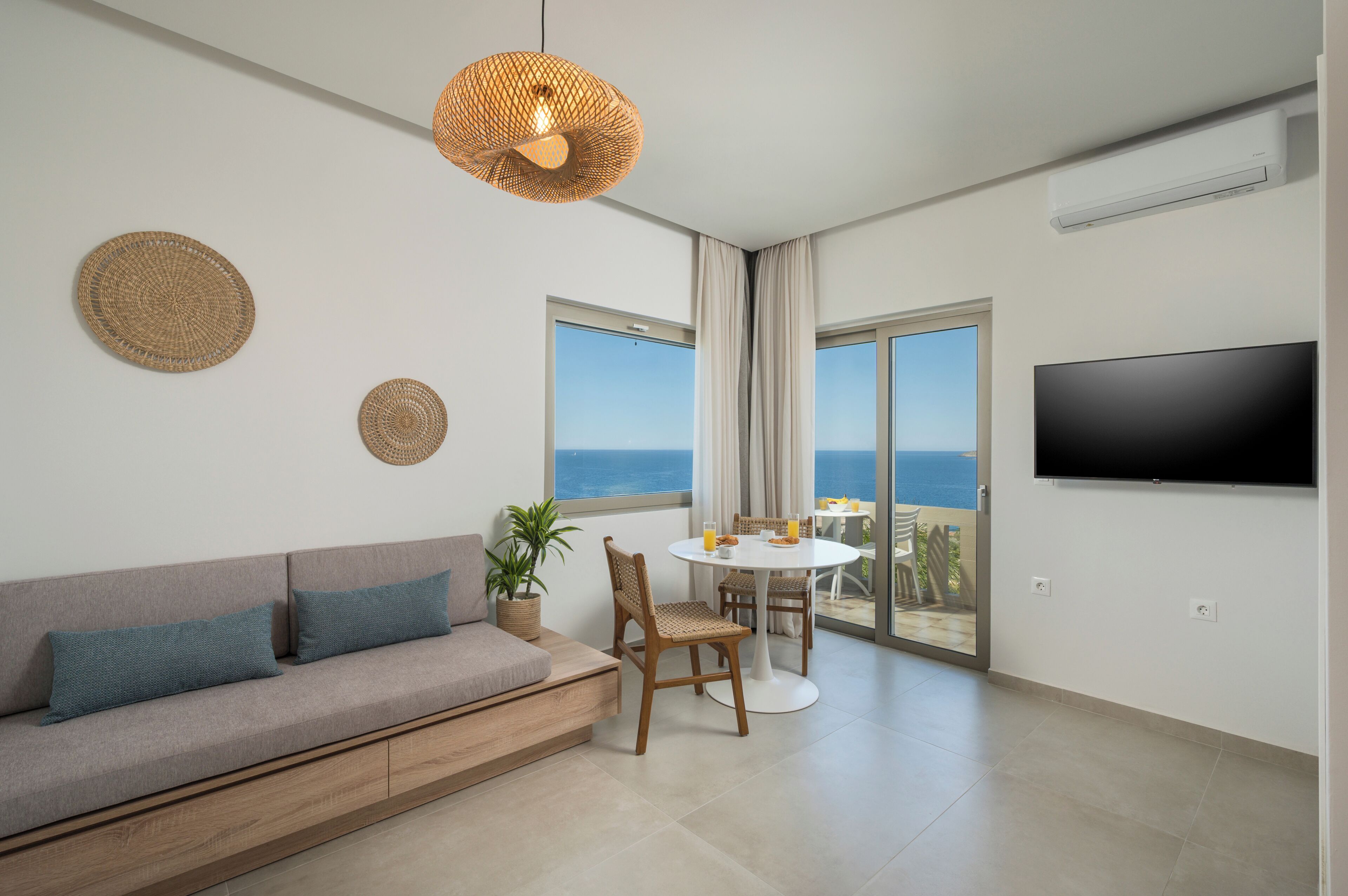 Superior Studio Suite, 1 King Bed, Sea View | Living area | 43-inch flat-screen TV with satellite channels, TV