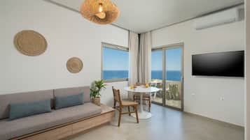 Superior Studio Suite, 1 King Bed, Sea View | Living area | 43-inch flat-screen TV with satellite channels, TV