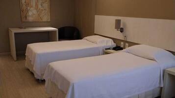 Superior Triple Room | Minibar, in-room safe, desk, blackout drapes