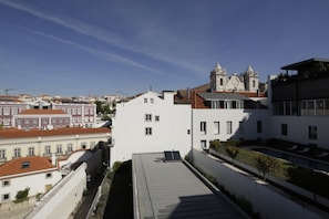 A modern building with a flat roof, large windows, and a small balcony. - Santa Catarina Superior Apartments by linc (Lisbon)