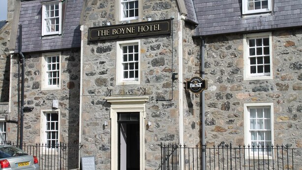 The Boyne Hotel with a stone facade, multiple windows, and a sign indicating it is a Best Rated establishment. - The Boyne Hotel (Banff)