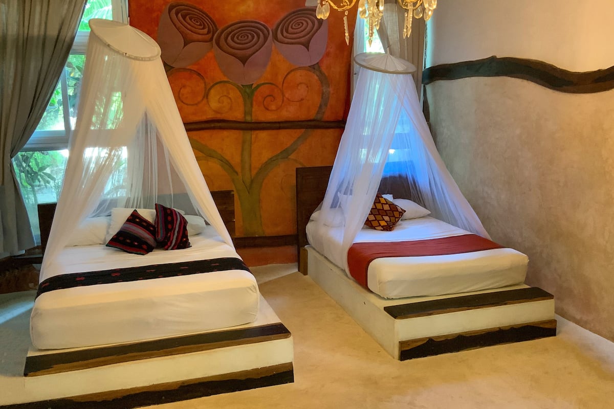 superior room two double beds with terrace garden view | in-room safe, free wifi