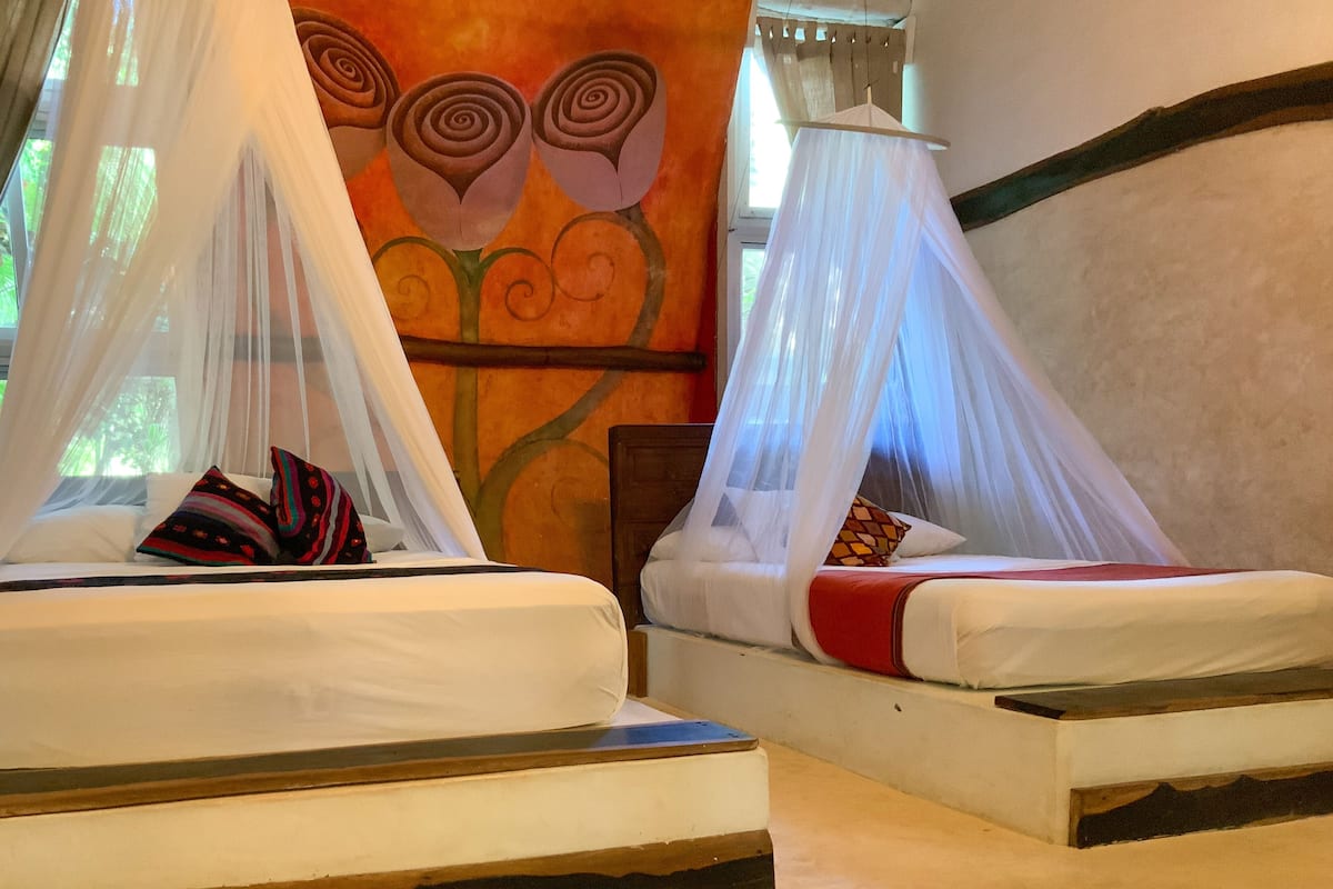 superior room two double beds with terrace garden view | in-room safe, free wifi