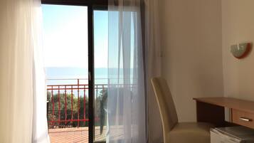 Standard Double Room, Balcony, Sea View | Living area | Flat-screen TV