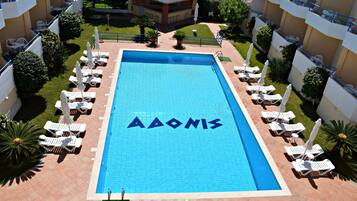 Seasonal outdoor pool, open 11:00 AM to 8:00 PM, pool umbrellas