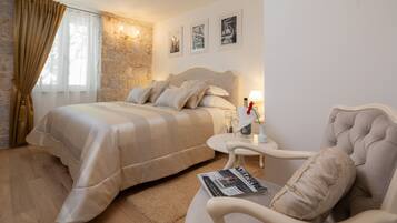 Premium bedding, down comforters, pillowtop beds, minibar