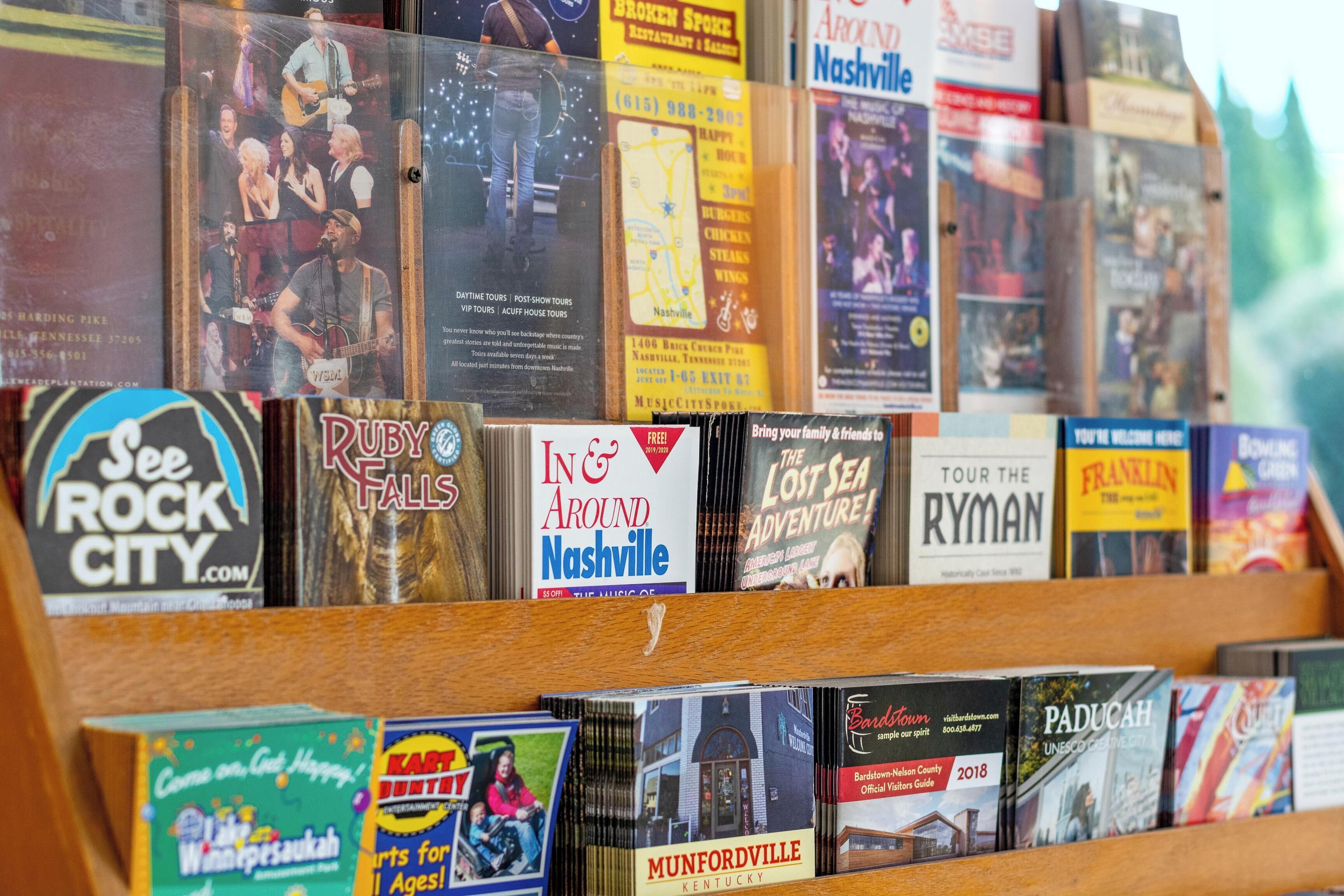 A display of travel guides and maps for Nashville and surrounding areas.