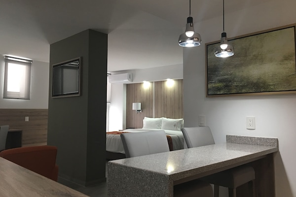 Deluxe Suite, 1 King Bed with Sofa bed | Living area | 43-inch flat-screen TV with cable channels, TV