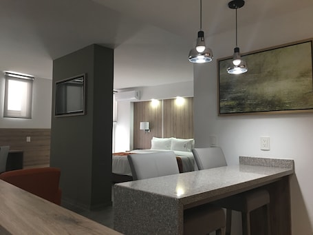 Deluxe Suite, 1 King Bed with Sofa bed | Living area | 43-inch flat-screen TV with cable channels, TV