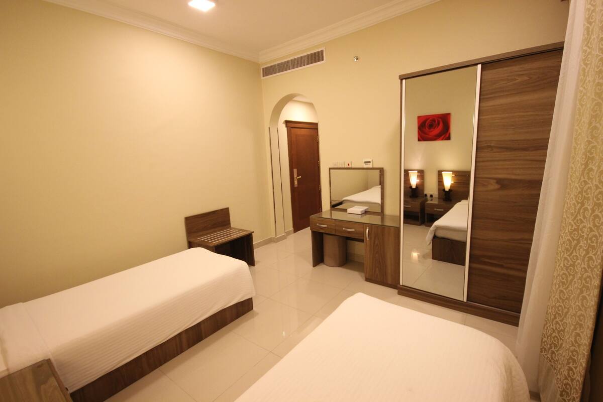 Twin Room | Minibar, in-room safe, iron/ironing board, rollaway beds (surcharge)