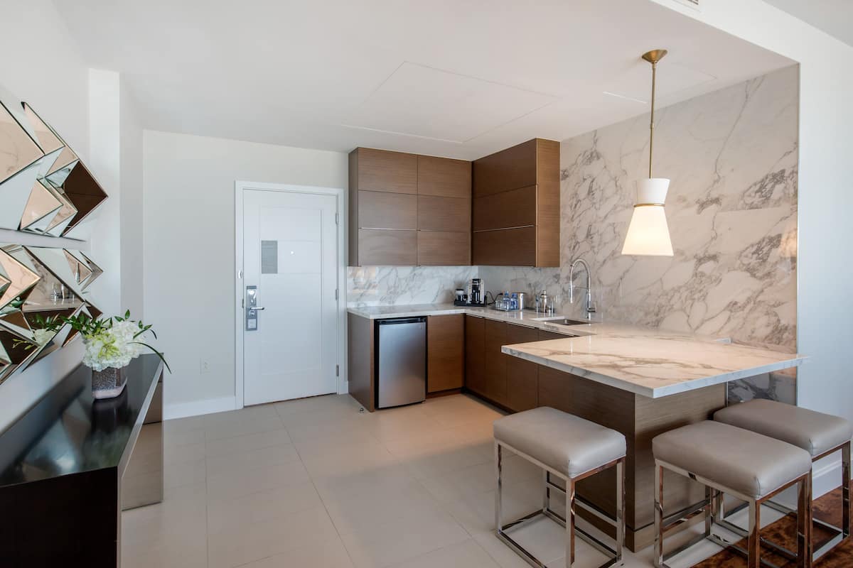 suite, 1 king bed (plaza suite) | in-room safe, desk, laptop workspace, iron/ironing board